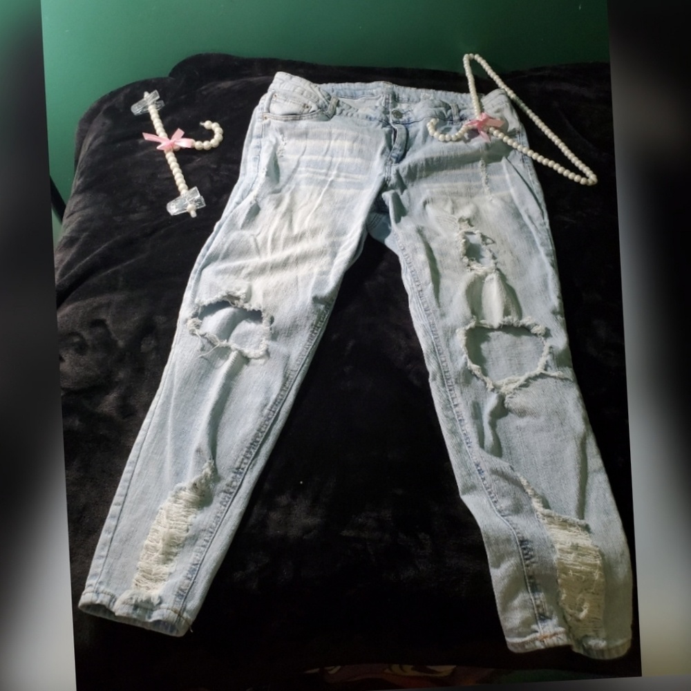Very distressed jeans, light wash color, size 20w